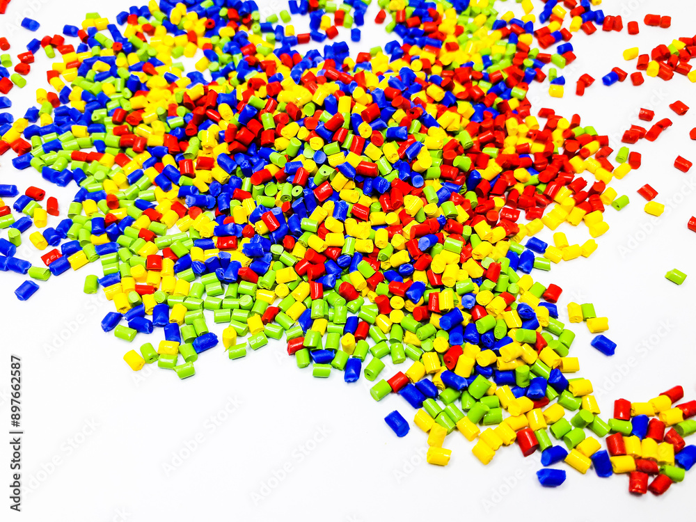 Various colored masterbatch granules on a white background, polymers that carry color pigments in the plastics industry Various colored masterbatch granules on a white background, polymers that carry color pigments in the plastics industry