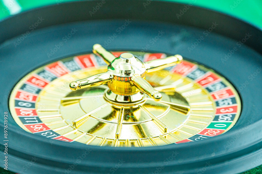Close up shot of a spinning roulette. Presentation of a luxury casino roulette wheel with a yellow spinning fireball. Polished, elegant roulette with golden elements in Las Vegas. Close up shot of a spinning roulette. Presentation of a luxury casino roulette wheel with a yellow spinning fireball. Polished, elegant roulette with golden elements in Las Vegas.