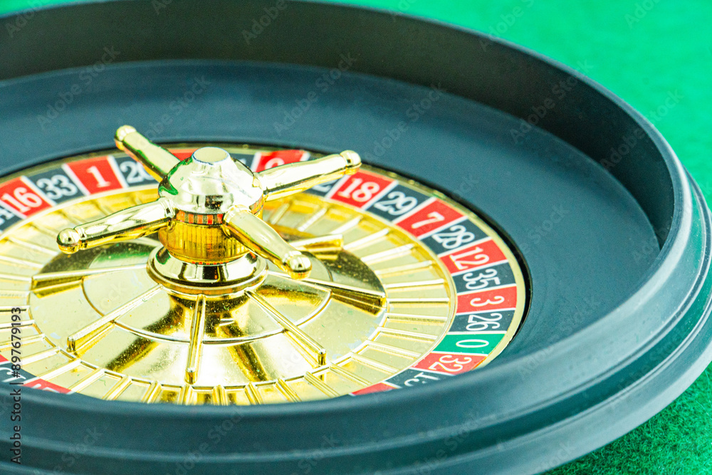 Close up shot of a spinning roulette. Presentation of a luxury casino roulette wheel with a yellow spinning fireball. Polished, elegant roulette with golden elements in Las Vegas. Close up shot of a spinning roulette. Presentation of a luxury casino roulette wheel with a yellow spinning fireball. Polished, elegant roulette with golden elements in Las Vegas.