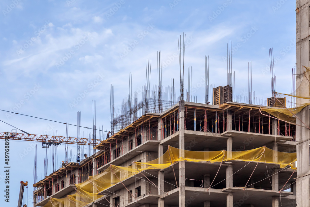 Fototapeta premium construction of modern high-rise residential frame and earthquake-resistant buildings with finishing in Kazakhstan