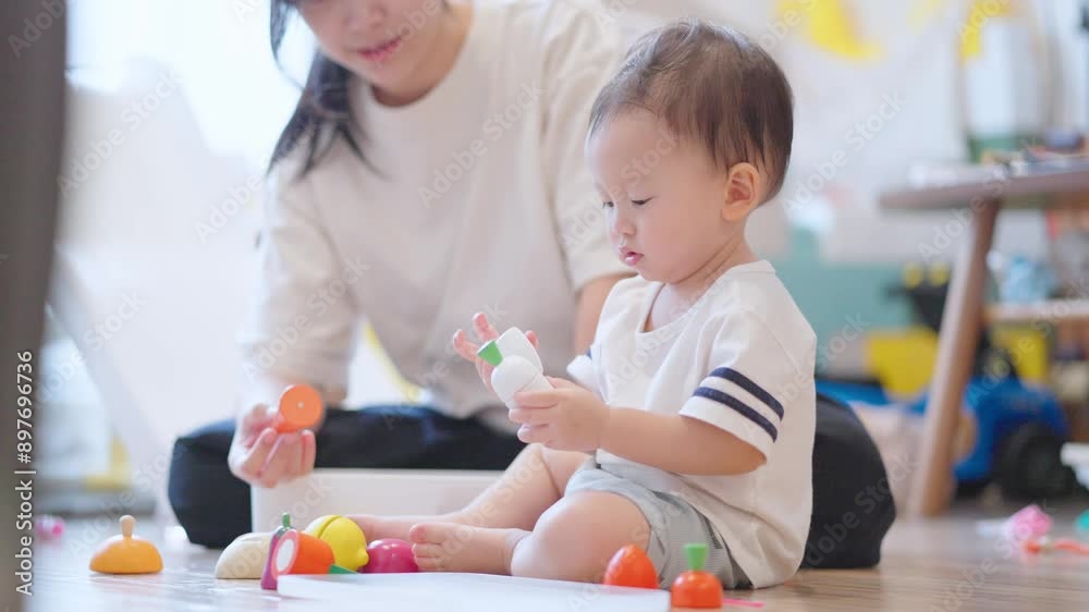 Asian mom playing with her son inside cozy livingroom, child playtime, home playroom learning from playing, home schooling teaching kid, single mom raising child alone, vegetables wooden toys Asian mom playing with her son inside cozy livingroom, child playtime, home playroom learning from playing, home schooling teaching kid, single mom raising child alone, vegetables wooden toys