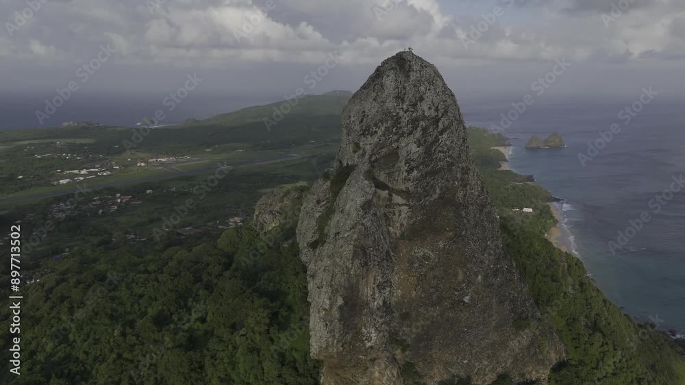 Drone flies over highest rock on island toward Dois Irmãos in Fernando de Noronha, Pernambuco, Brazil Drone flies over highest rock on island toward Dois Irmãos in Fernando de Noronha, Pernambuco, Brazil