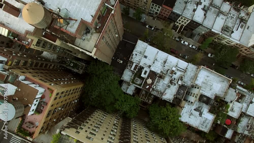 Birds eye view of urban cityscape with highrise buildings and streets captured by a drone Birds eye view of urban cityscape with highrise buildings and streets captured by a drone