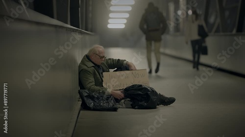 Wallpaper Mural Elderly beggar at night, reflecting struggles of homelessness and poverty in urban society Torontodigital.ca