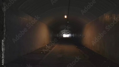 Running walking through dark tunnel at night, danger, escape, first person view pov