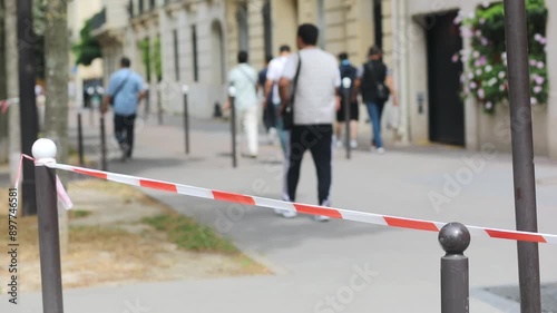 Wallpaper Mural Red and white striped plastic tape in Paris, France. Boundary used to close off areas and streets. Parisian street closed for pedestrians. Torontodigital.ca