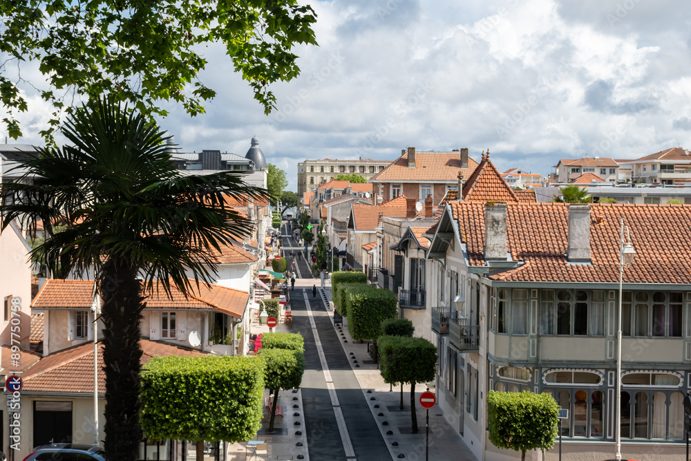 Walking in Arcachon, vacation destination town on Atlantic coast with beatiful parks, villas, streets and sandy beach, France