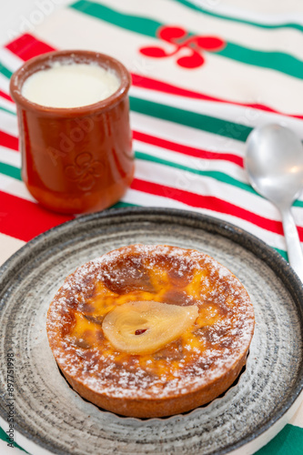 Basques food, sheep’s milk curd dessert Mamia or Cuajada, Curd, maman, gatzatua or gaztanbera Original Basque Dessert curdled with rennet and homemade pears cake photo