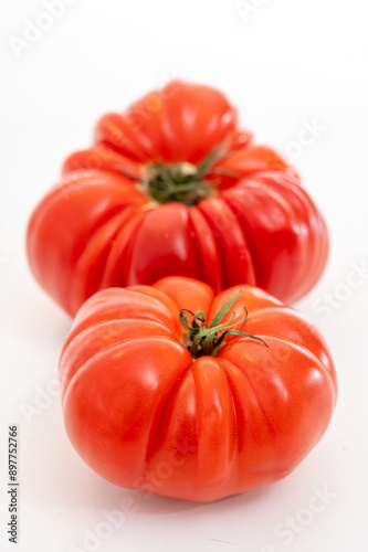 Sweet tasty ripe red french tomatoes from Brittany, France, salad seasonal vegetables photo