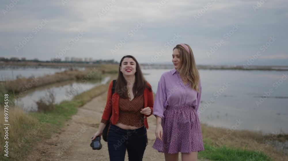 Two professional photographers approach the camera Two professional photographers approach the camera