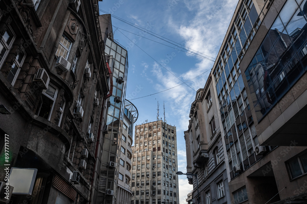 Fototapeta premium Palace Albanija (Palata Albanija) in center of Belgrade seen from pedestrian street of Sremska Ulica. Opened in 1939, This building is an architectural landmark of Terazije district & belgrade center.