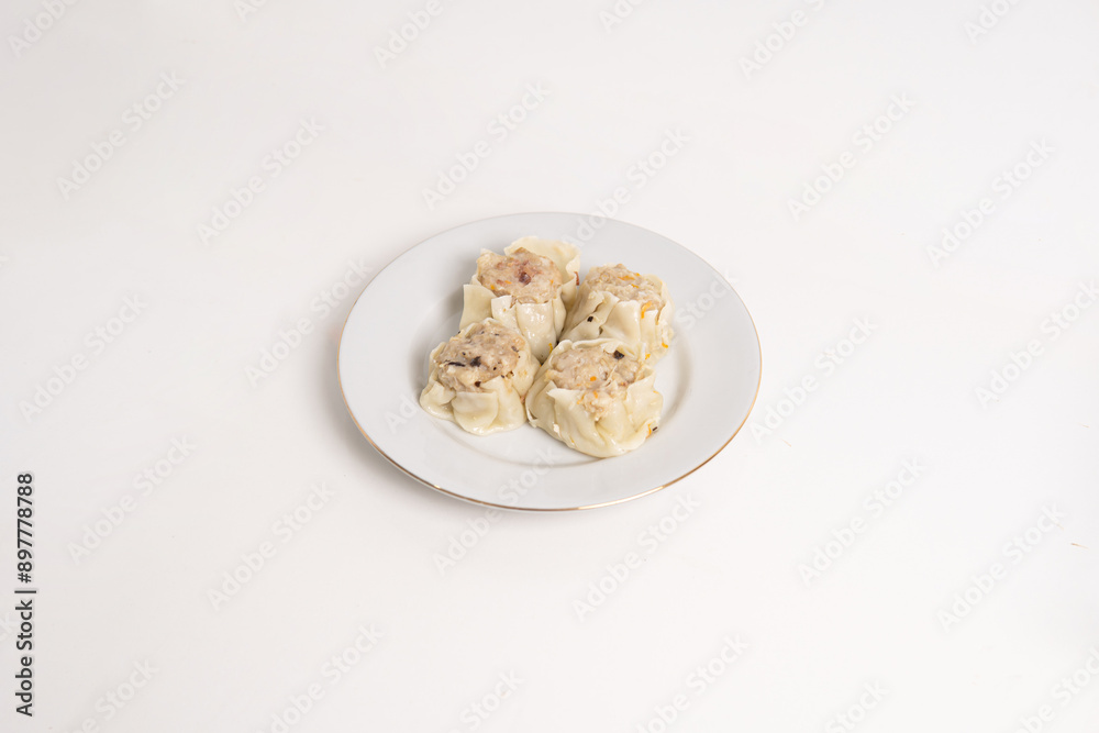 chicken and beef dimsum served on white plate and white background, unique food from china chicken and beef dimsum served on white plate and white background, unique food from china