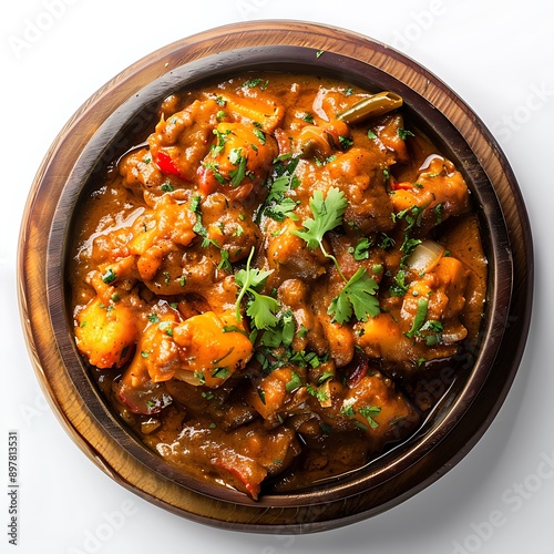 Board and plate of tasty Undhiyu with on white background. photo