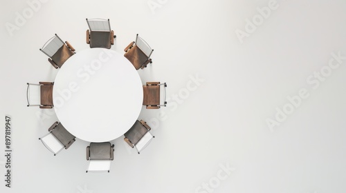 Eight empty office chairs encircle a round table in a white room, evoking a feeling of promise and excitement