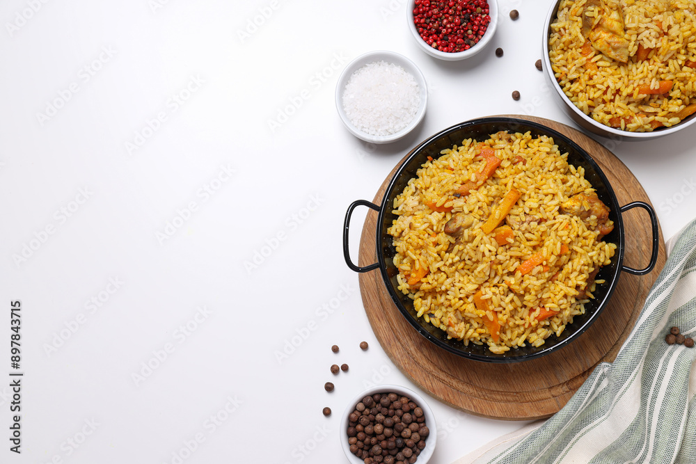 Pilaf and spices on white background, space for text Pilaf and spices on white background, space for text