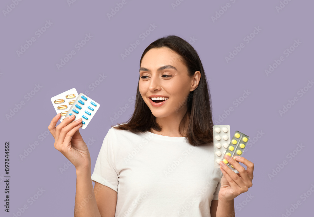 Pretty young woman with pills on lilac background Pretty young woman with pills on lilac background