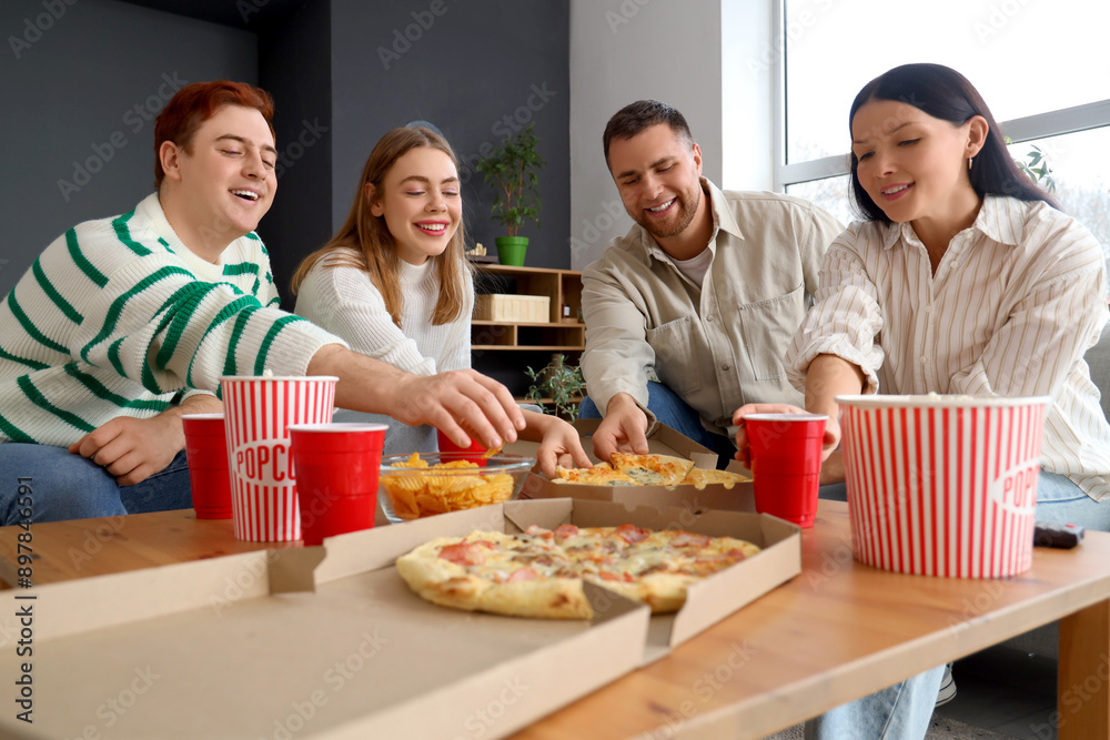 © Pixel-Shot - Young friends with beer and snacks resting at home