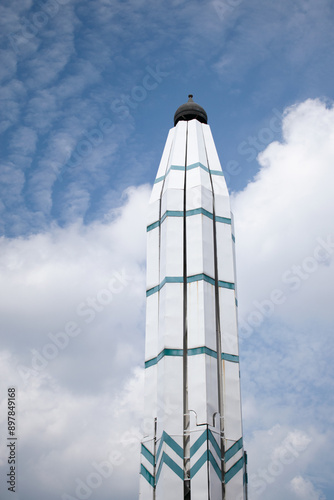 Tower of Umbrella closed with cloudy blue sky background. Masjid agung Jawa Tengah Indonesia photo