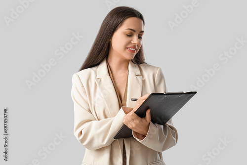 Pretty businesswoman with c...