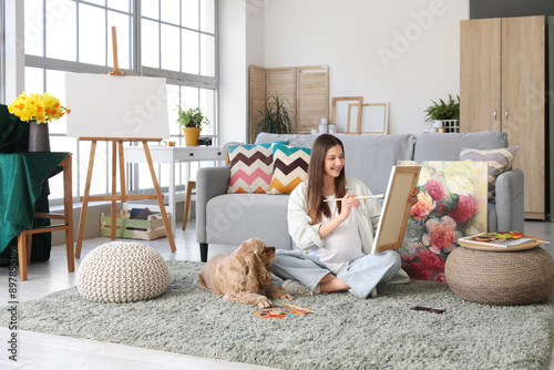 Pregnant artist sitting on ...