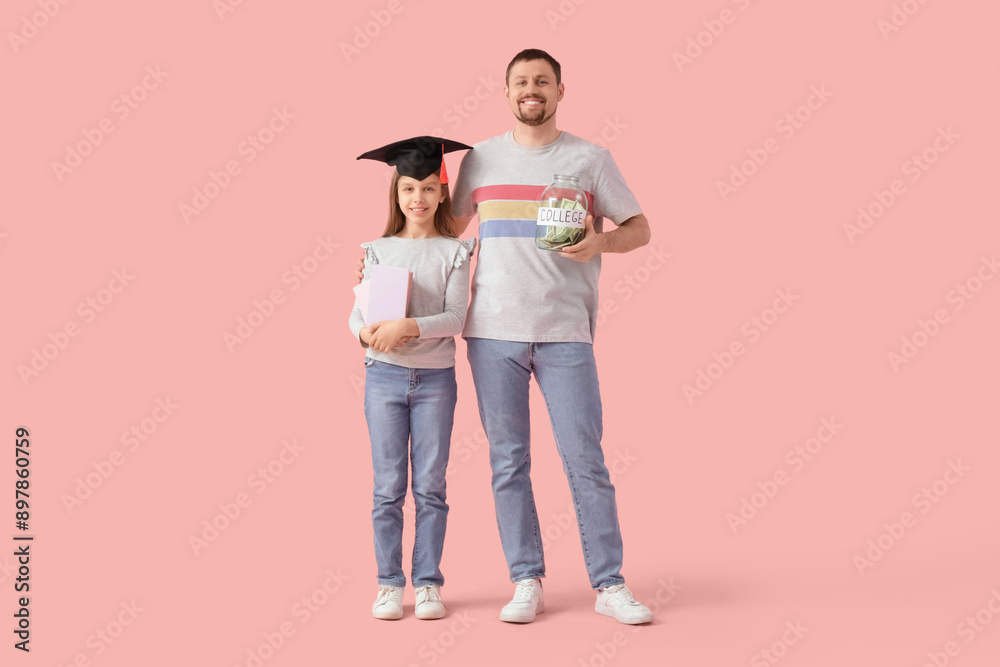 Father and his daughter in mortar board with books and money jar on pink background. Tuition fees concept Father and his daughter in mortar board with books and money jar on pink background. Tuition fees concept