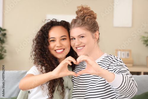 Women making heart with the...