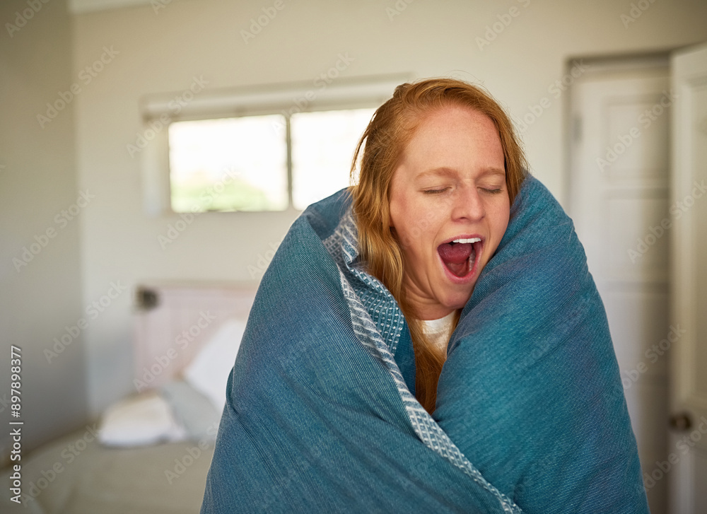 Fototapeta premium Woman, blanket and tired in morning with yawn for burnout, warm and sleeping problem in home. Female person, wake up and open mouth in bedroom for fatigue with duvet, insomnia and relax in Ireland