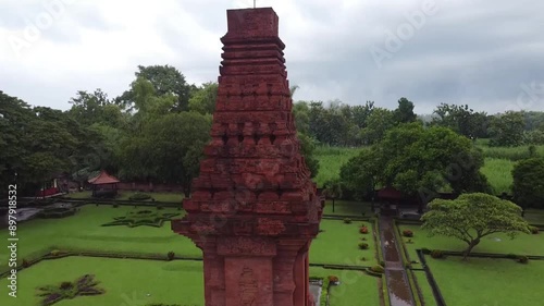 Drone shot of Bajang Ratu Temple on a cloudy day, a temple from the Majapahit kingdom located in Trowulan, Mojokerto, East Java, Indonesia. This temple is a Hindu temple.