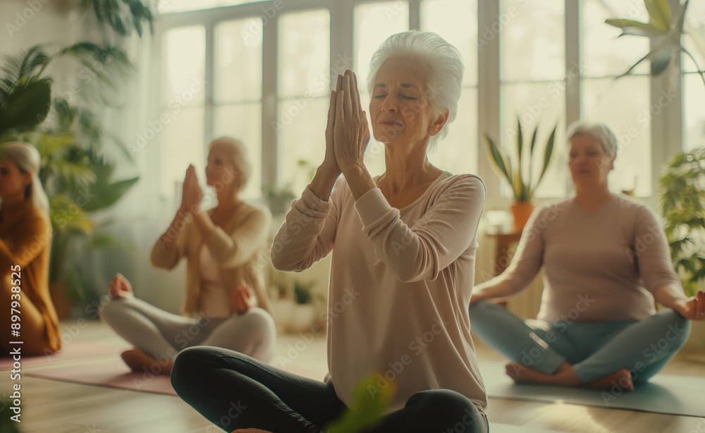 Elderly women practicing yoga in a bright, lush indoor garden setting. Elderly women practicing yoga in a bright, lush indoor garden setting.