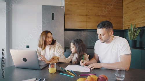 In a modern household, parents and children build strong bonds through drawing together at the kitchen table, fostering a warm and creative atmosphere filled with love and collaboration