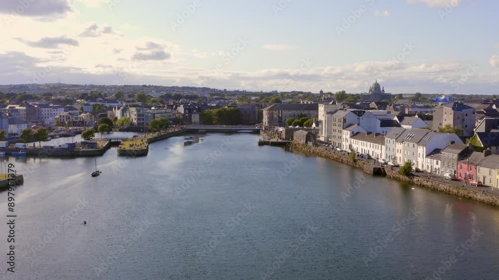 Aerial pullback over the River Corrib, showcasing the Long Walk and Claddagh. Establishing shot. Aerial pullback over the River Corrib, showcasing the Long Walk and Claddagh. Establishing shot.