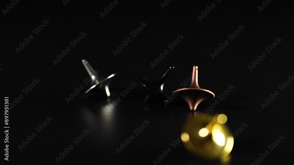 Spinning Tops in Motion Spinning Tops in Motion