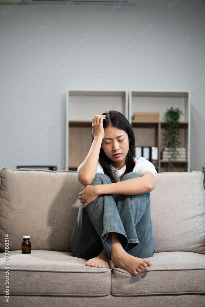 woman sit Depression Dark haired pensive glance Standing by window on sofa and anxiety woman sit Depression Dark haired pensive glance Standing by window on sofa and anxiety