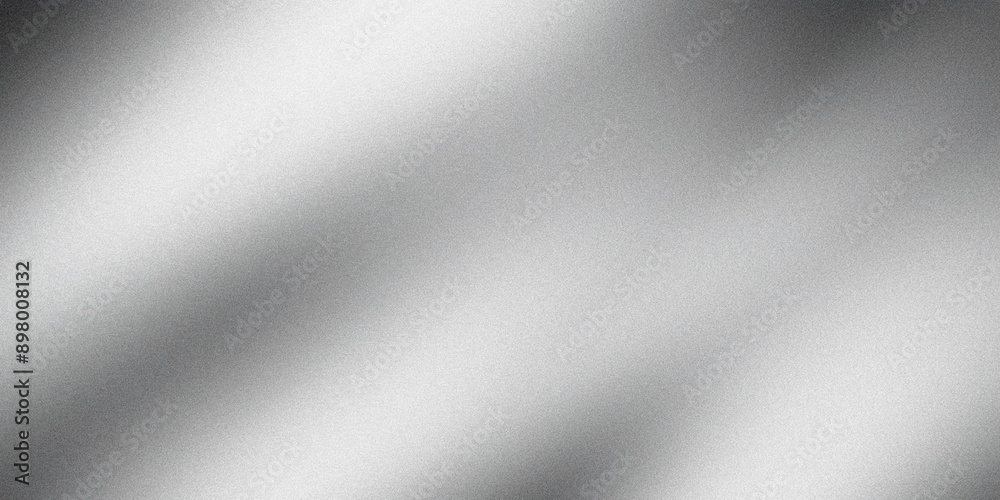 Silver background with light reflections creating a metallic grainy texture Silver background with light reflections creating a metallic grainy texture