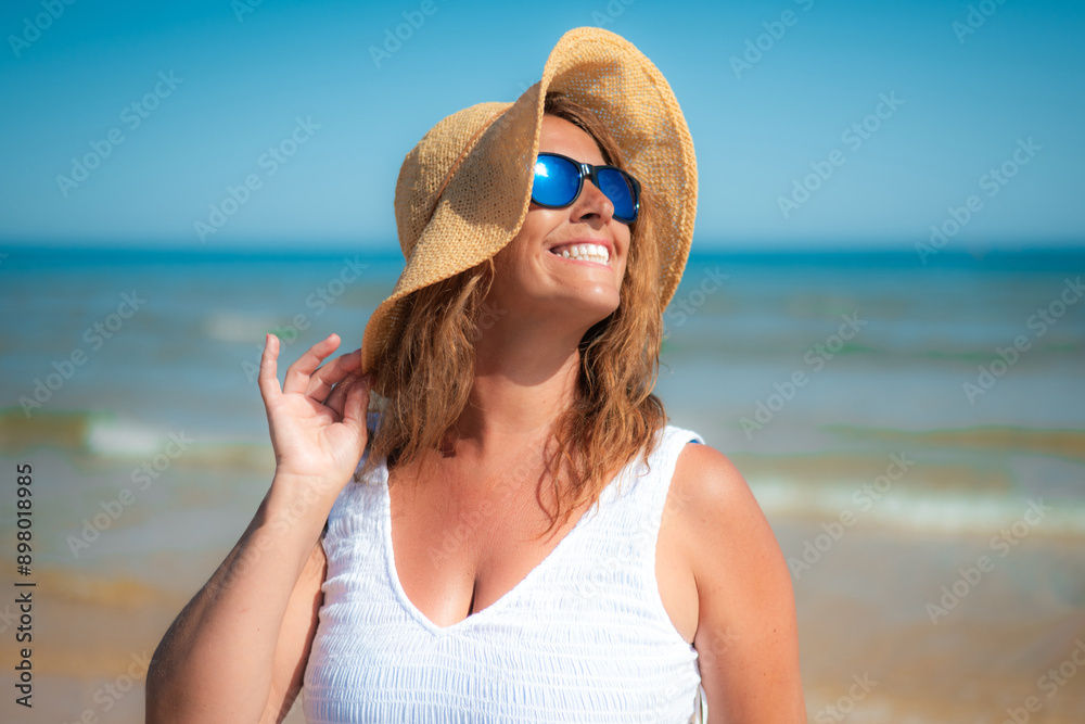 Mature Woman With A Perfect Smile Enjoying A Day At The Beach Mature Woman With A Perfect Smile Enjoying A Day At The Beach
