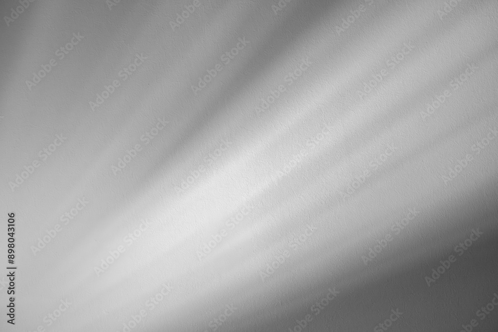 Studio style background wall decoration presentation uses white tones. with shadows cast from a nearby window, concept creating a decorative backdrop.