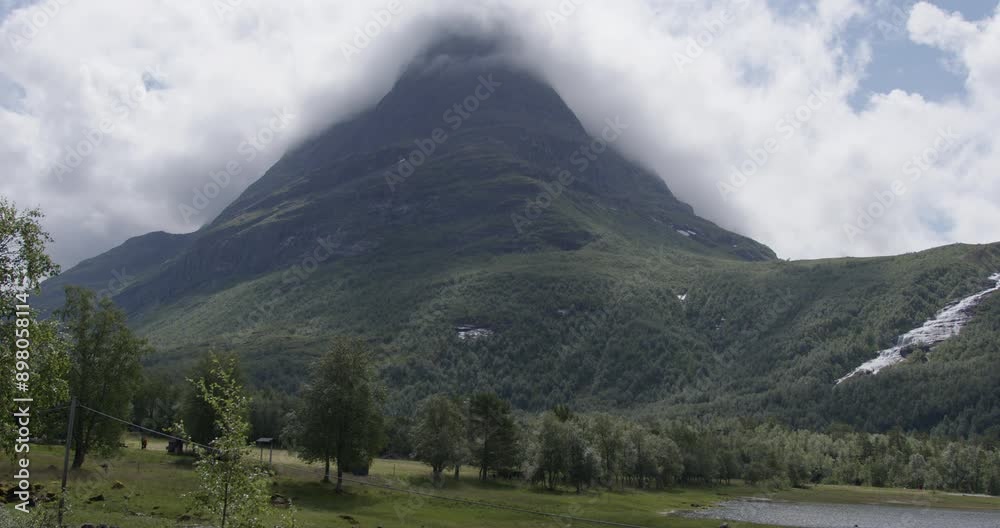 Summer in Norway. Beautiful valley Innerdalen, lake Innerdalsvatna and mountain Innerdalstårnet. Summer in Norway. Beautiful valley Innerdalen, lake Innerdalsvatna and mountain Innerdalstårnet.