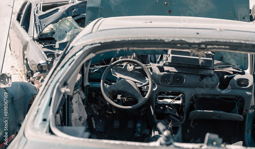 Wallpaper Mural destroyed cars in a city lost in the war in Ukraine Torontodigital.ca
