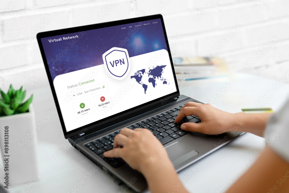 Using a VPN on a laptop. Web page concept with VPN connection and world map, emphasizing global online security and privacy Using a VPN on a laptop. Web page concept with VPN connection and world map, emphasizing global online security and privacy
