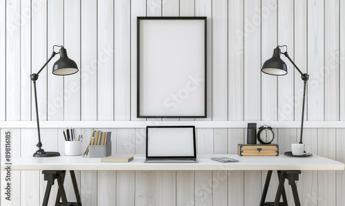 Minimalist desk setup with a blank frame two lamps and a few dec photo