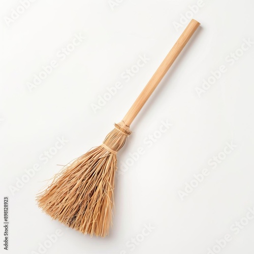 broomstick on solid white background, single object photo