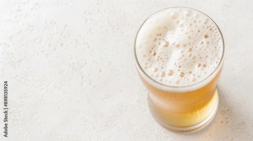 Effervescent chilled beer with hops, overhead perspective, frothy suds, clear and crisp, highlighting the refreshing chill Effervescent chilled beer with hops, overhead perspective, frothy suds, clear and crisp, highlighting the refreshing chill
