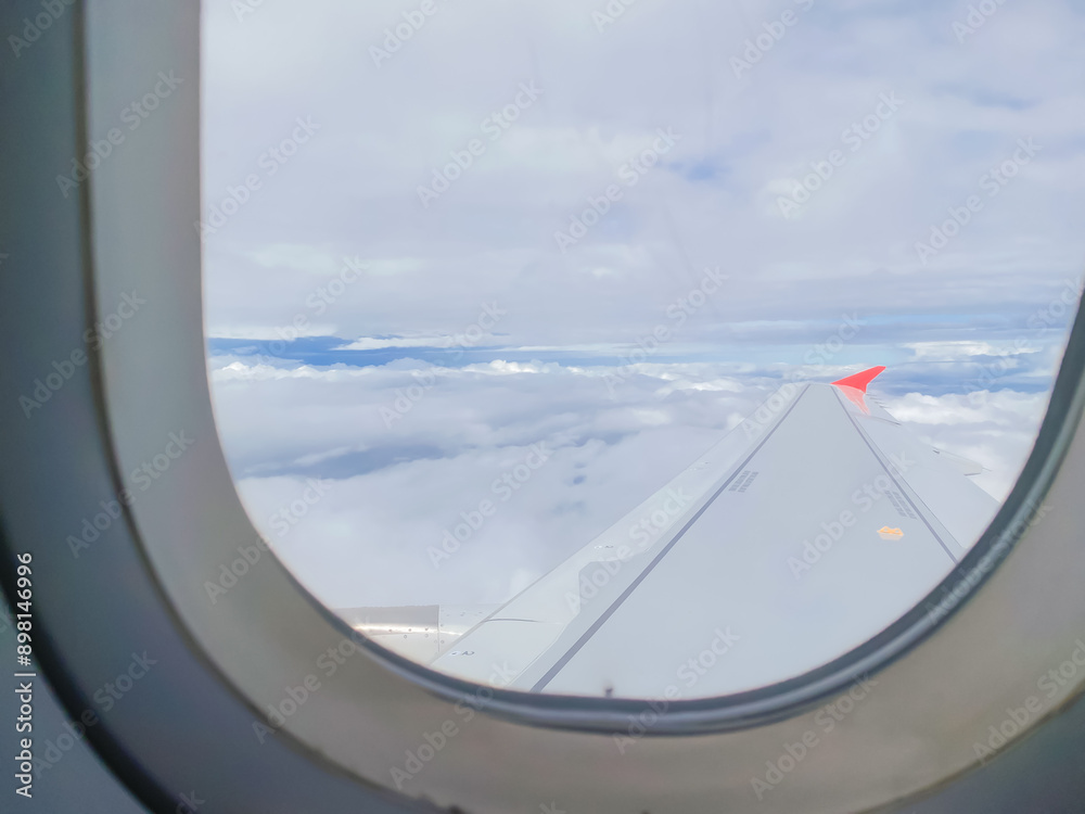 travel and transportation concept with see city and beautiful sky from airplane window travel and transportation concept with see city and beautiful sky from airplane window