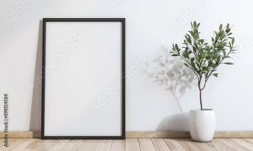 Minimalist interior design with a blank photo frame and a potted photo