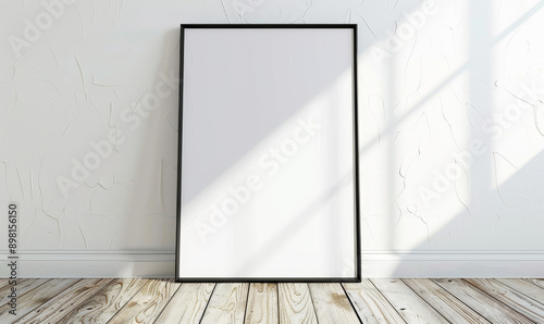 Blank frame on the white concrete wall with natural sunlight and photo