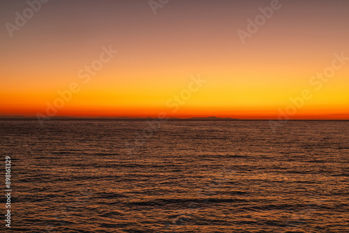 Sunset Serenity,Beautiful Horizon of Orange Sky and Reflective Waters