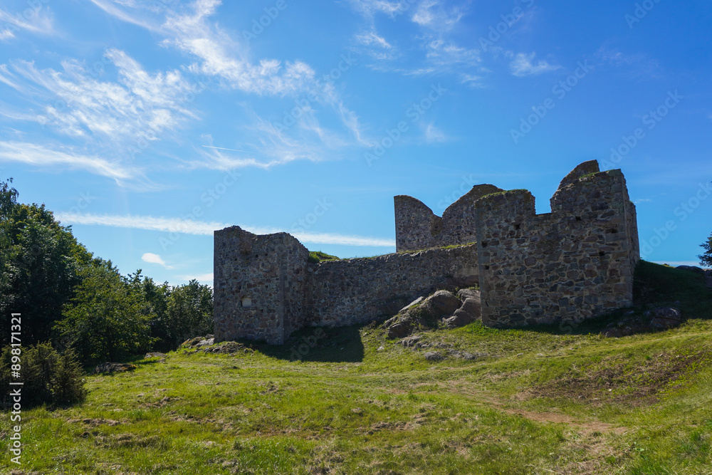 A large stone ruin with a grassy field in Gränna A large stone ruin with a grassy field in Gränna