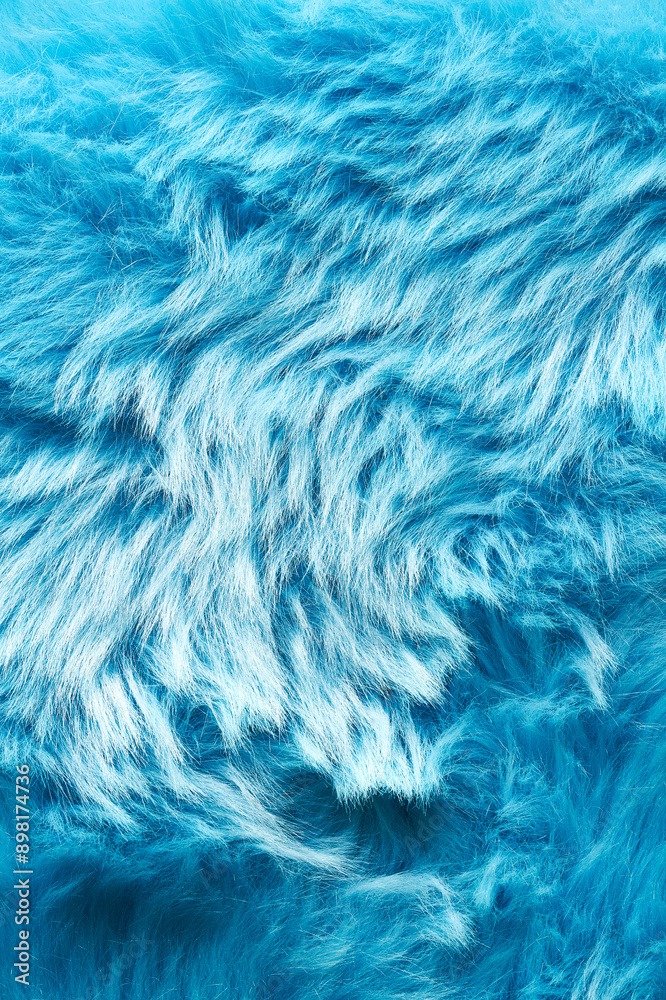 Obraz premium Photo of textured blue faux fur. Soft and delicate texture creates a feeling of comfort and coziness, ideal as a background in fashion projects, packaging design, advertising materials.