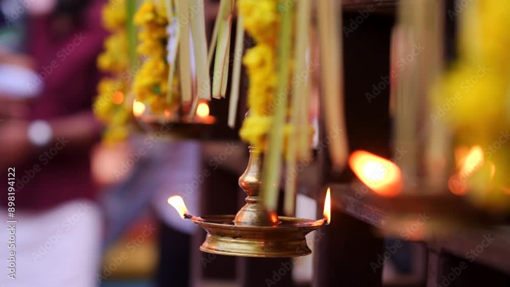 Traditional south indian brass oil lamp Nilavilakku . Nilavilakku is lighted before starting the rituals This picture is taken during Kerala traditional ulsavam
