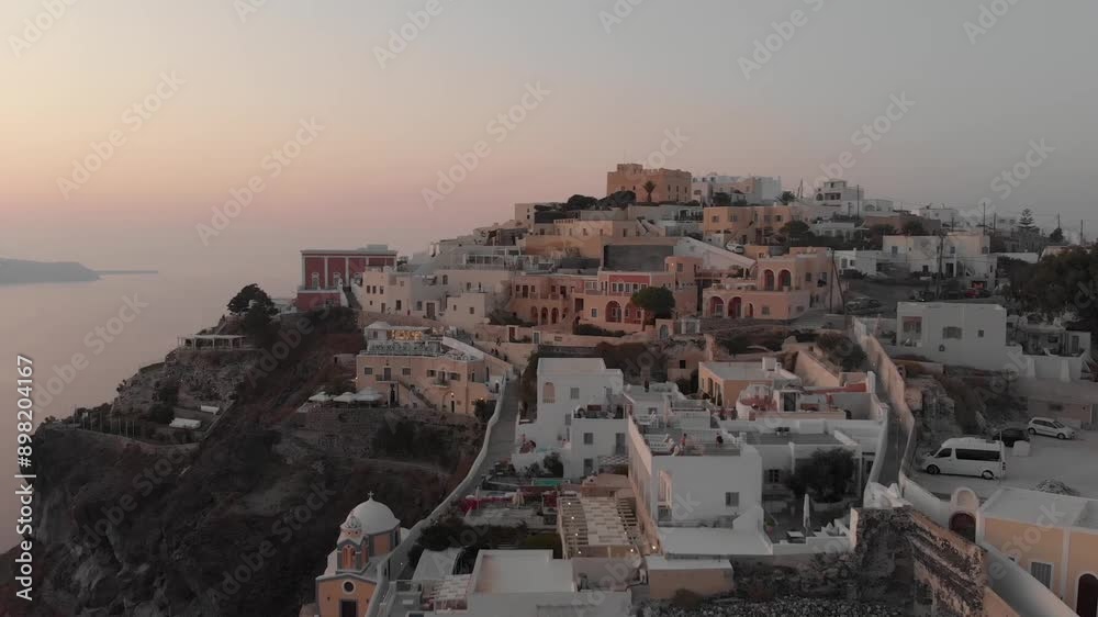 Drone from above view of white houses, hotels with pools and churches in Fira, Santorini Island, Greece. Thira city. Aegean Sea, Mediterranean. Panoramic aerial drone view from above
Drone from above view of white houses, hotels with pools and churches in Fira, Santorini Island, Greece. Thira city. Aegean Sea, Mediterranean. Panoramic aerial drone view from above